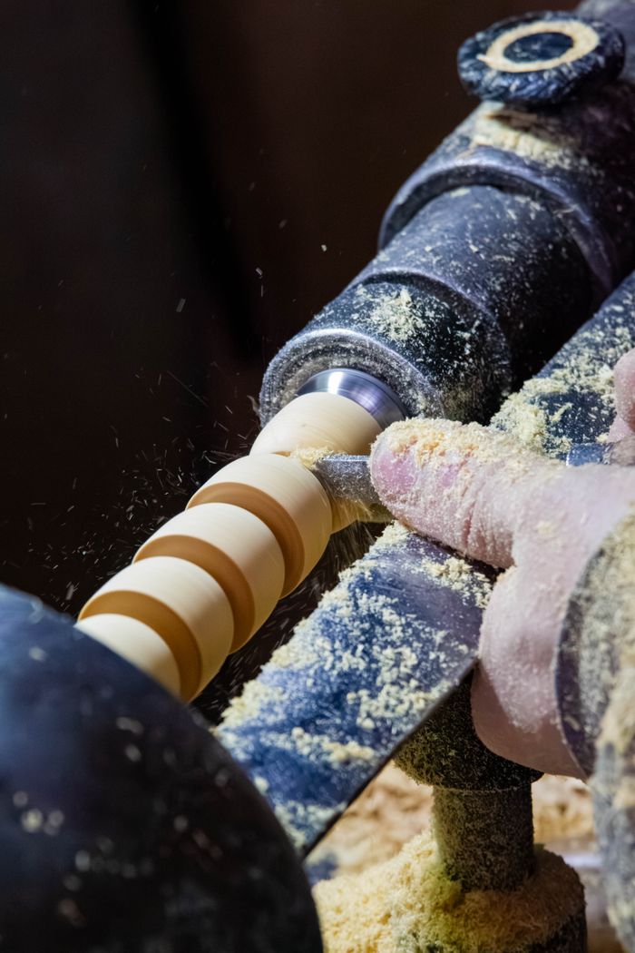 gallery-6 Close-up of woodturning on a lathe, showcasing traditional craftsmanship in Fes, Morocco.